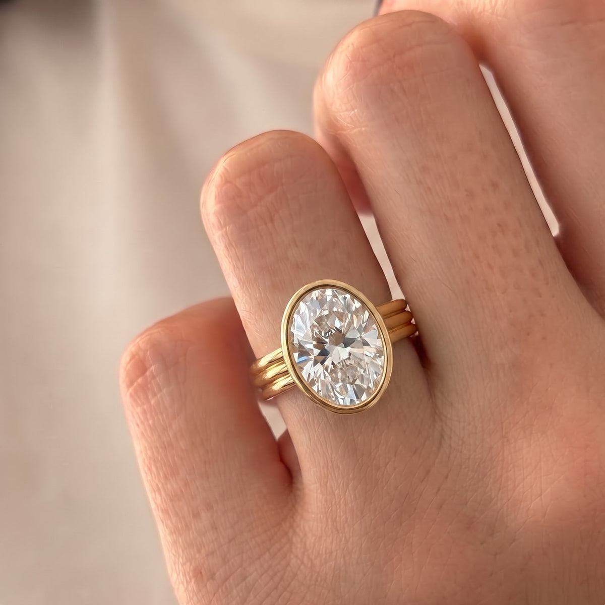 Phoebe Dynevor – Inspired Oval Cut Bezel Lab Grown Diamond Engagement Ring