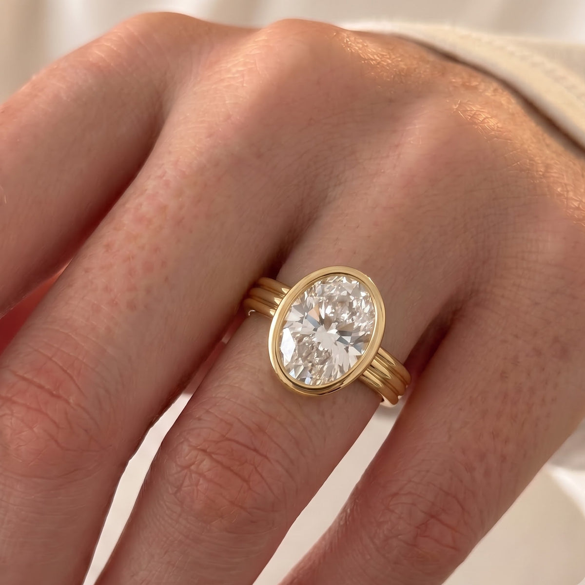 Phoebe Dynevor – Inspired Oval Cut Bezel Lab Grown Diamond Engagement Ring